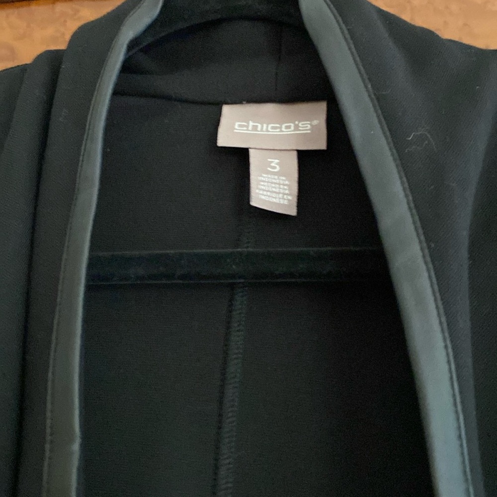 Chicos Black draped jacket with faux leather at front, pockets and shoulders.